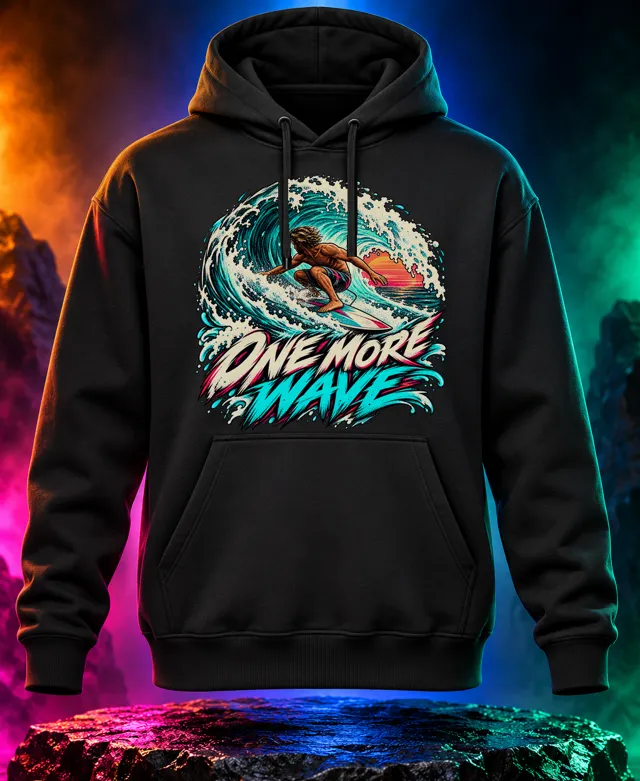 One More Wave hoodie with an adult surfer riding inside a turquoise barrel with One More Wave brush lettering. Black option. Digital mockup.