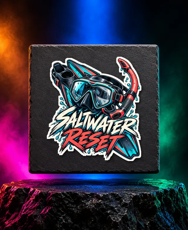 Saltwater Reset sticker with a detailed diving mask, snorkel and crossed swim fins with Saltwater Reset brush lettering. White option. Digital mockup.