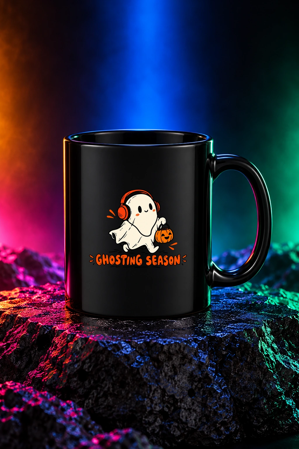 Black mug with the Ghosting Season artwork. A headphone-wearing ghost and a little pumpkin make Ghosting Season a playful Halloween escape. Digital studio mockup.