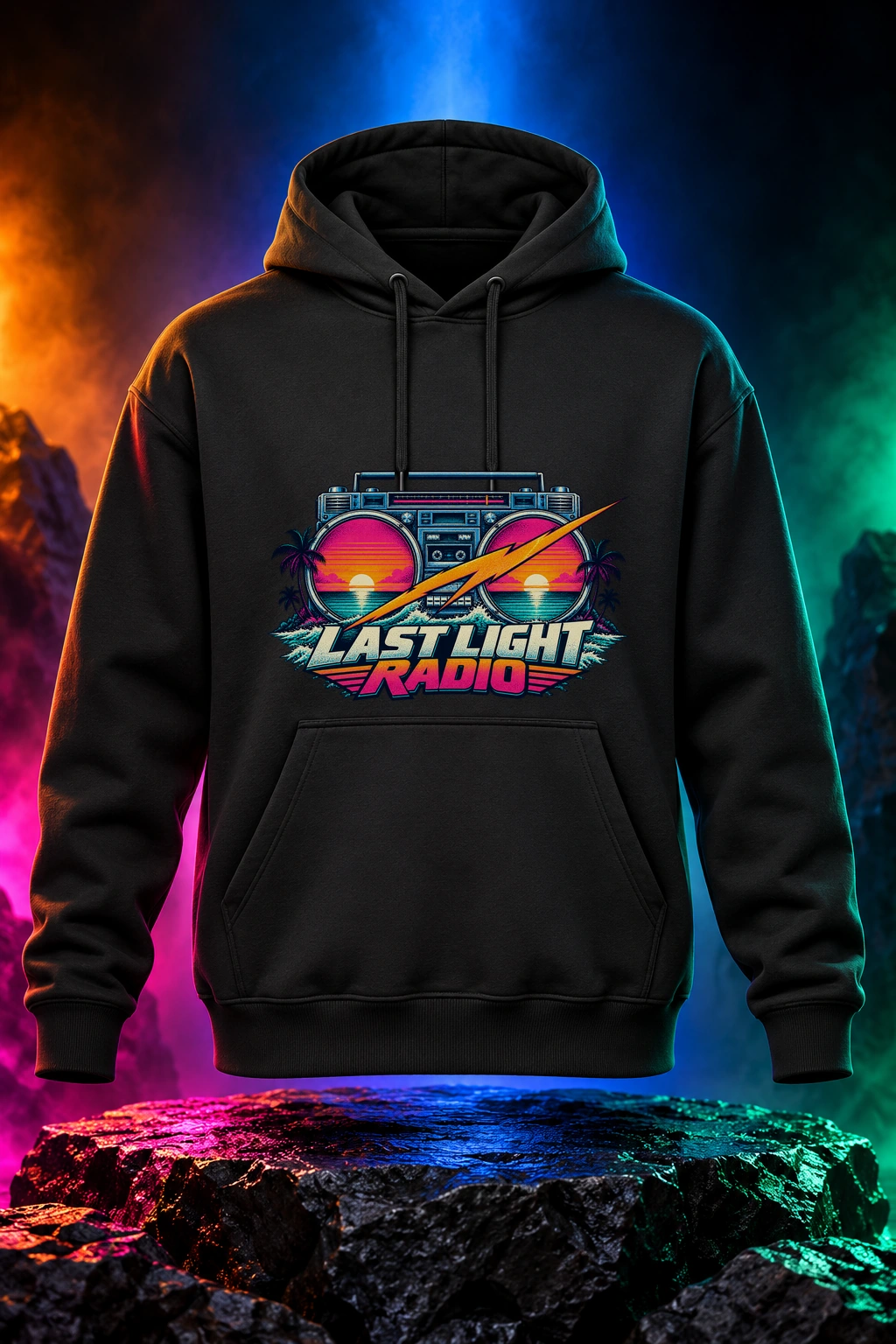 Black hoodie with the Last Light Radio artwork. Last Light Radio brings a vintage boombox and electric sunset colors together for an after-dark coastal mood. Digital studio mockup.