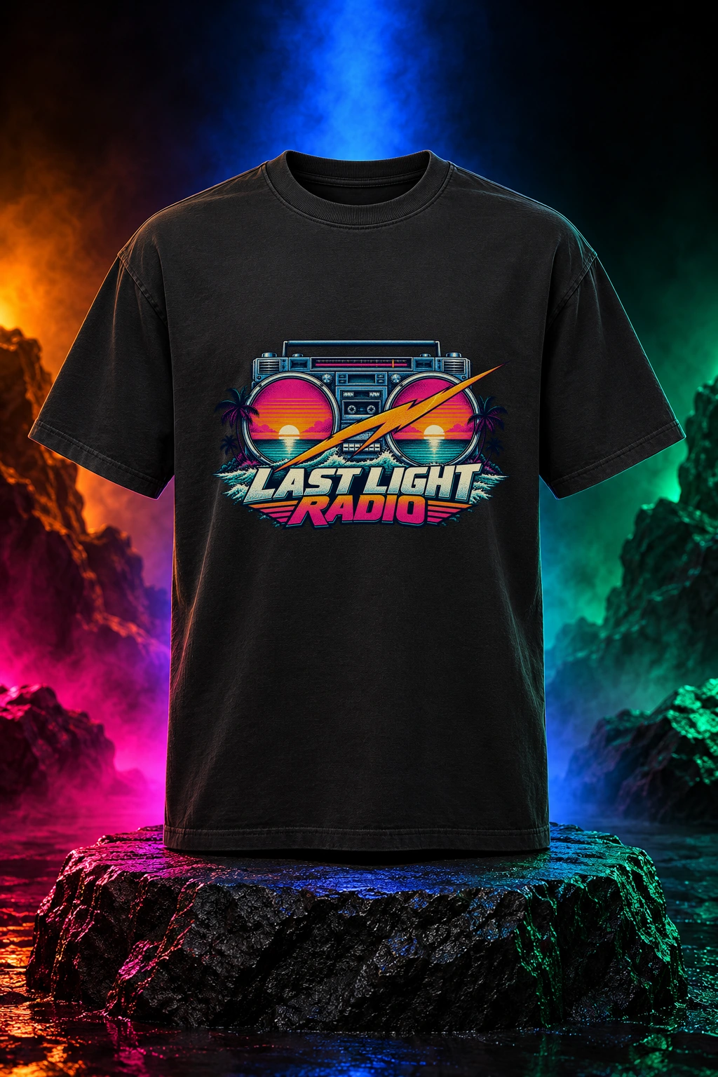 Black tee with the Last Light Radio artwork. Last Light Radio brings a vintage boombox and electric sunset colors together for an after-dark coastal mood. Digital studio mockup.